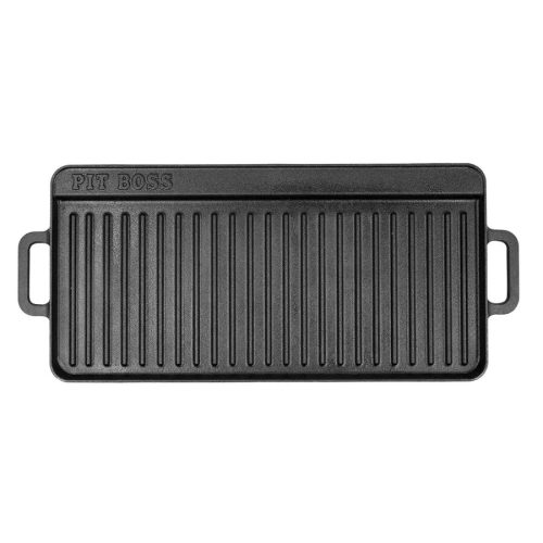 Stor, vendbar støpejernsgriddle (35,5 cm x 71 cm) med glatt og ribbet side. Perfekt for grill og komfyr, gir jevn varmefordeling og har innebygd fettkar for enkel rengjøring.